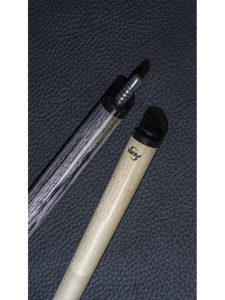 a close up of a cue stick